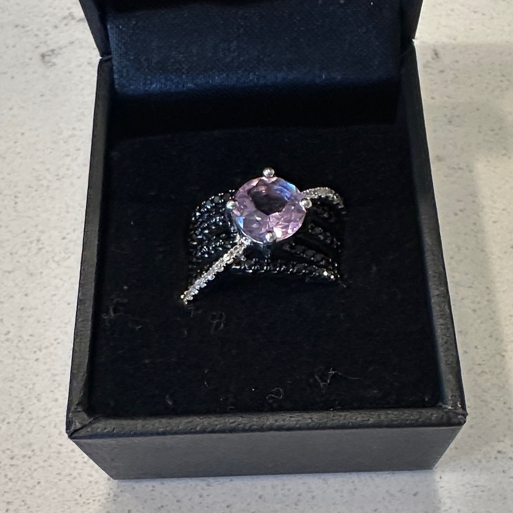 Elegant Black and Silver Ring with Purple Gemstone